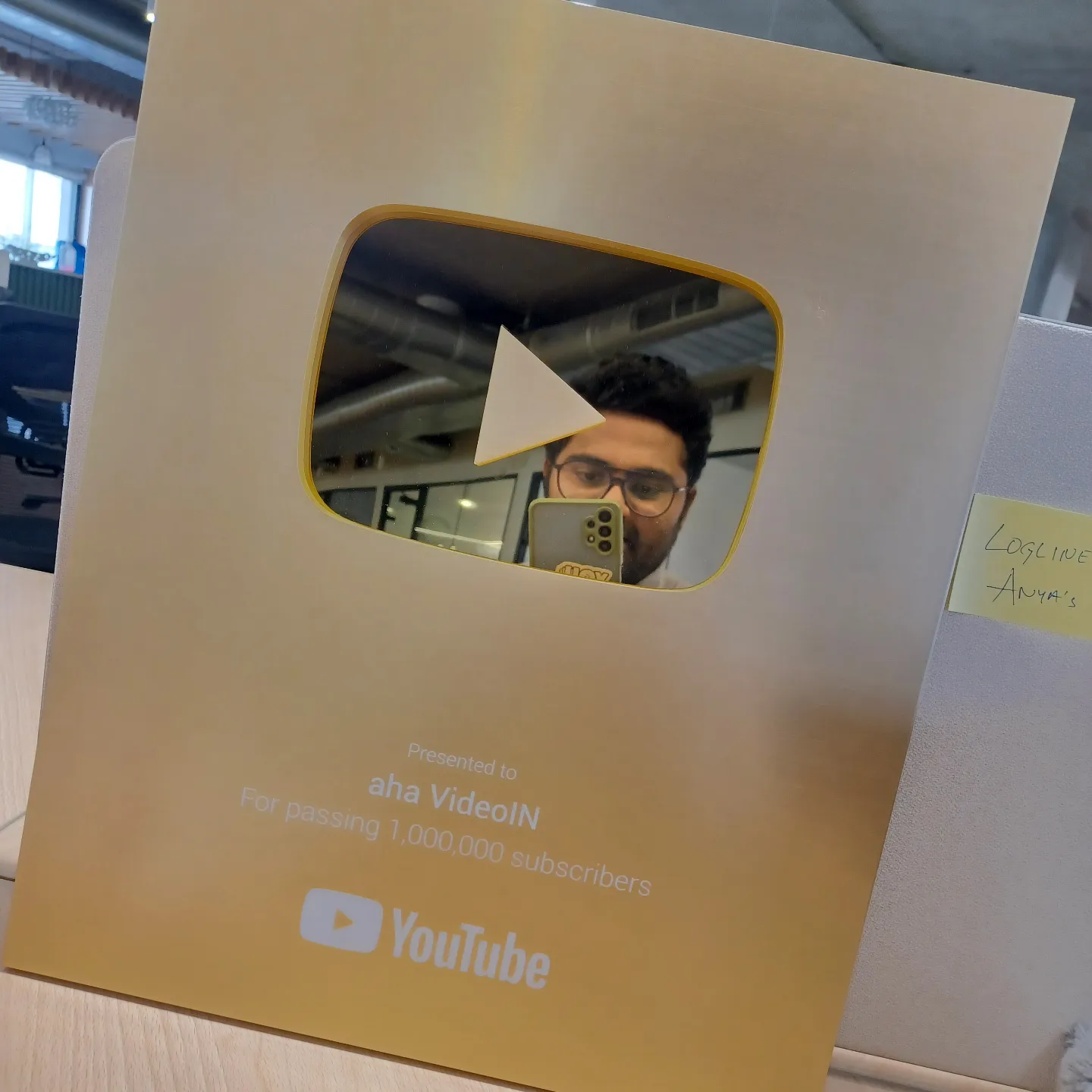Vamshi reflected in the YouTube Gold Play Button for passing 1,000,000 subscribers on aha VideoIN